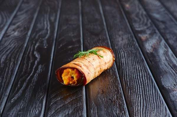 Appetizer for reception. Eggplant stuffed with fried carrot