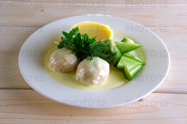 Meatballs with creamy sauce and mashed potato