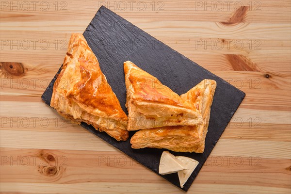 Puff pastry with cheese on slate plate