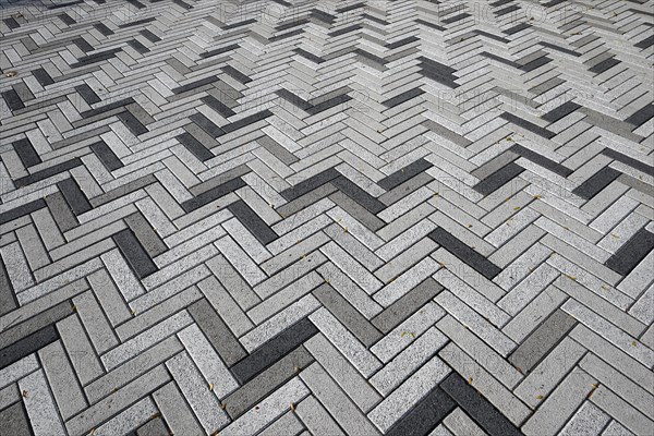 Creative structure with paving stones on sidewalk