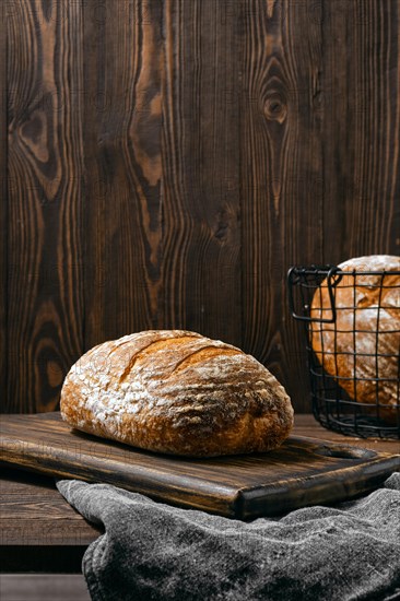 Artisan whole grain wheat bread on wooden table