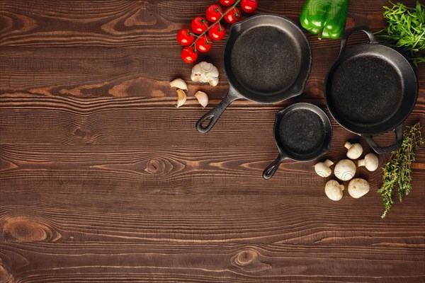 Table with cast-iron pan and spices