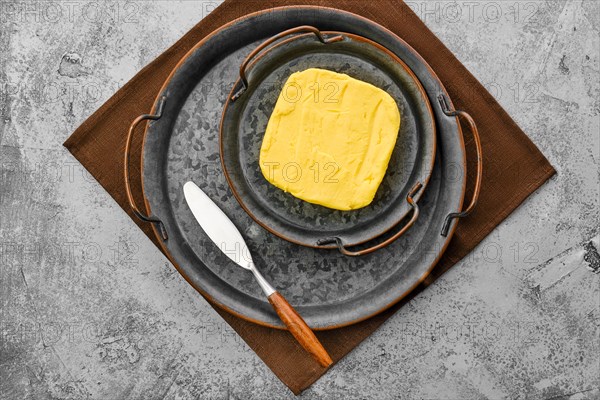 Homemade rustic butter and a spreading knife