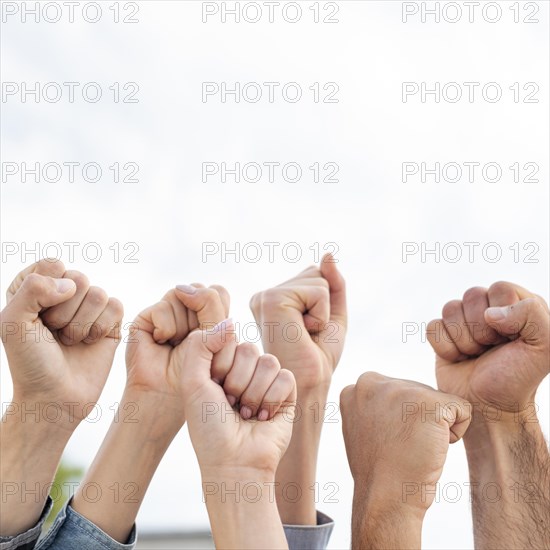 Group activists holding fists up