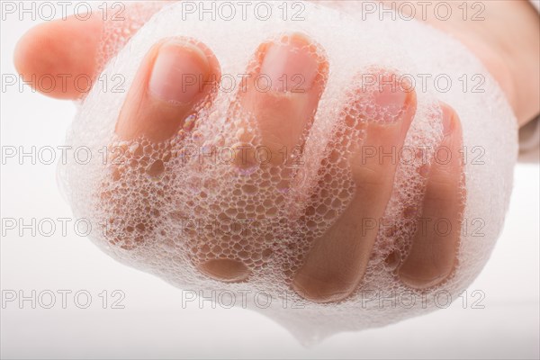 Hand washing and soap foam on a foamy background