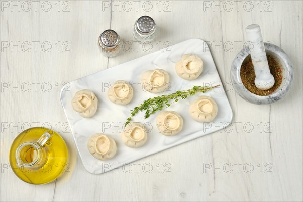 Top view of frozen dumplings with turkey and tarragon