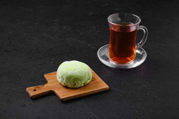 Sweet dessert mochi with kiwi with fruit tea