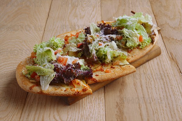 Freshly baked focaccia with salad leaves