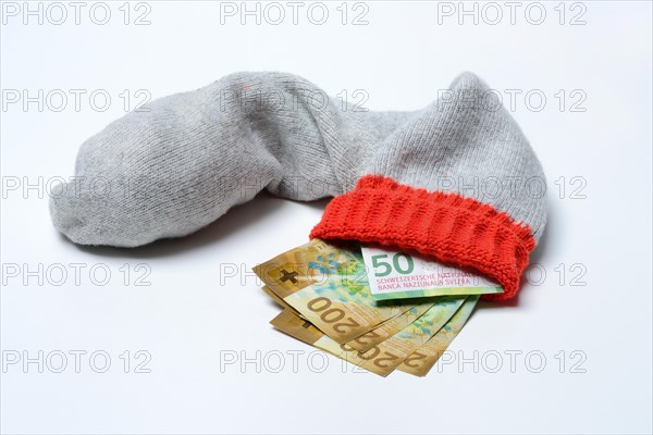 Banknotes in woollen sock