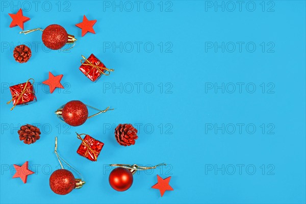 Christmas flat lay with red ornaments in shape of tree baubles