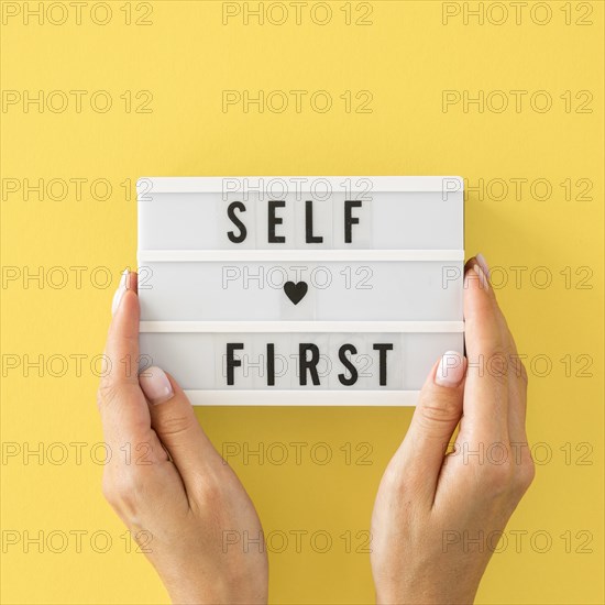 Close up hands holding message board