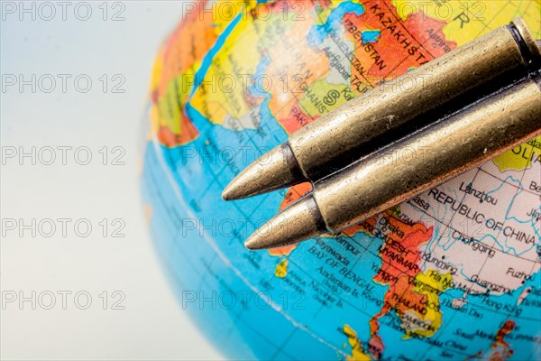 Bullet on a globe as against the war conceptual photography