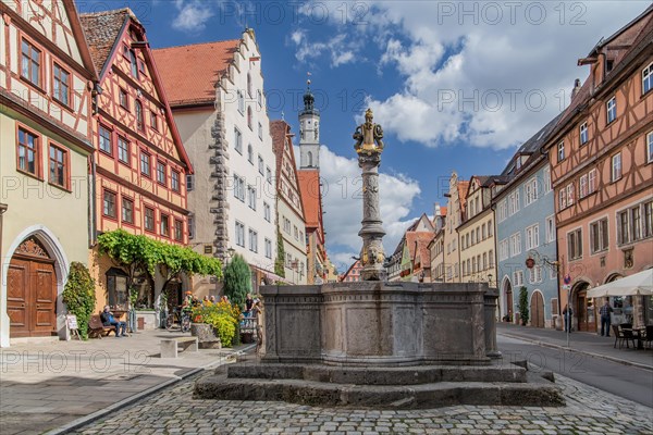 Herrnbrunnen in Herrngasse with Town Hall Tower