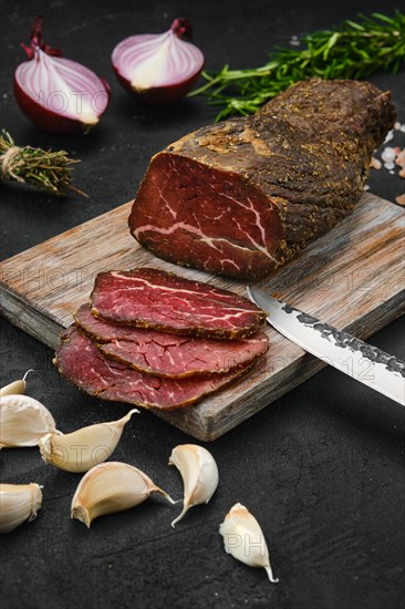 Beef jerky on wooden cutting board