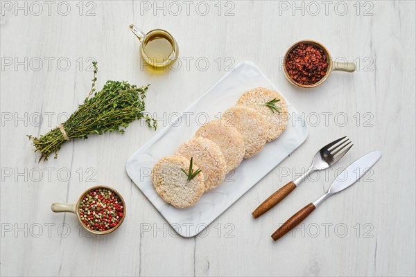 Semifinished chicken cutlet in breading ready for frying