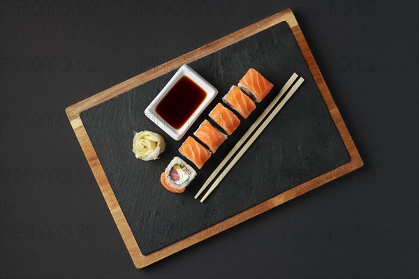 Rolls with salmon and tuna on stone plate