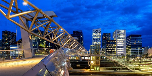 Oslo skyline modern city architecture building with bridge in Barcode District panorama at night in Oslo