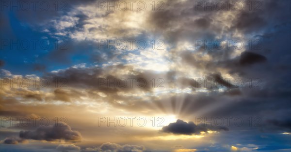 Sunbeams shining through atmospheric stratocumulus cloud