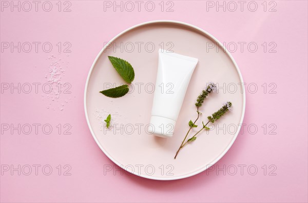 Top view assortment with cream bottle and leaves. Resolution and high quality beautiful photo