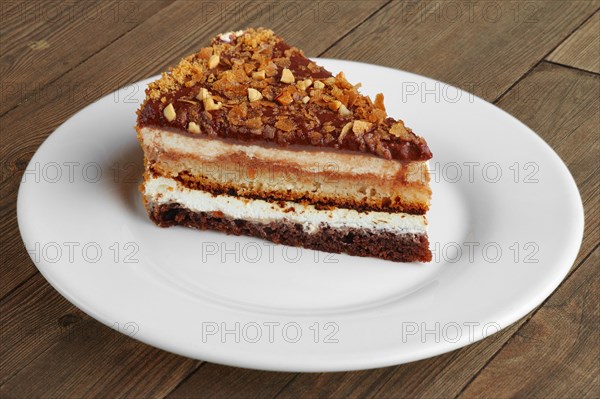 Chocolate sliced cake on wooden table