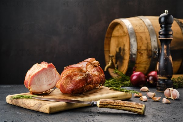 Smoked lamb meat on wooden cutting board