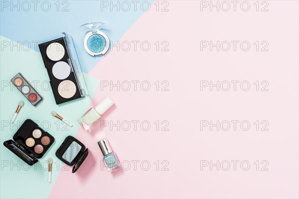 Overhead view cosmetic products pastel background