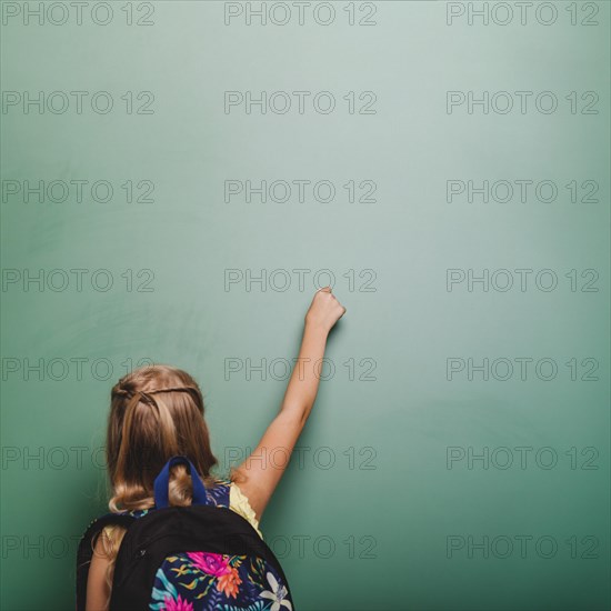 Pupil girl writing blackboard. Resolution and high quality beautiful photo