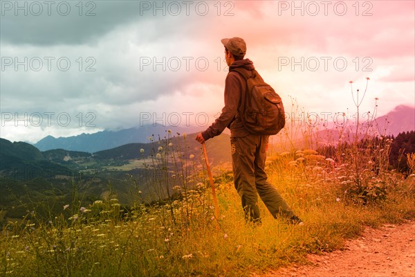 Hikers with backpacks and trekking poles walking in Turkish highland