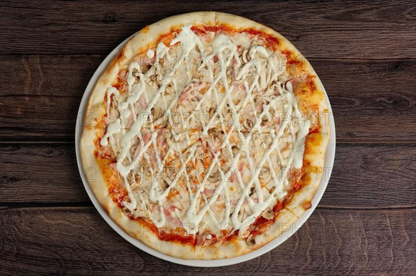 Top view of pizza with chicken fillet