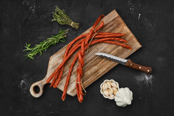 Overhead view of long thin homemade pork sausages with garlic