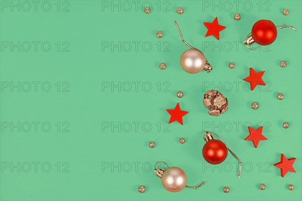 Christmas flat lay with seasonal golden and red tree ornament baubles