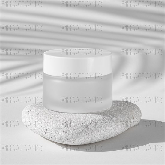 Skin care moisture recipient on a white rock