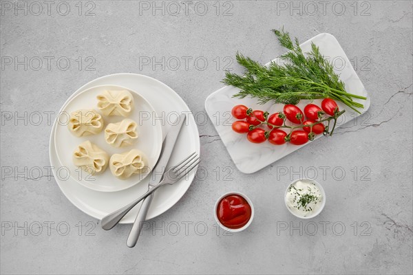 Top view of frozen semifinished manti stuffed with lamb meat