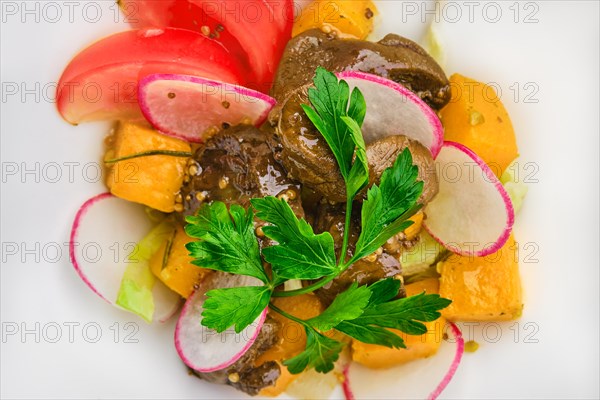 Macro photo of salad with fried chicken liver