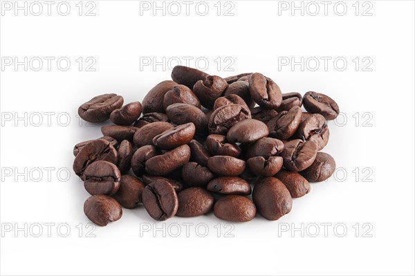 Coffee beans scattered on white background