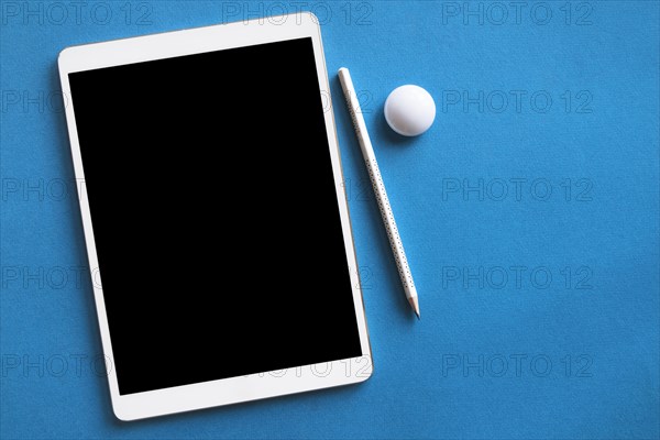 White tablet pencil blue surface. Resolution and high quality beautiful photo
