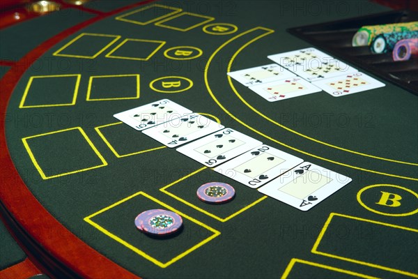 Casino black jack table with chips and cards. Winning combination