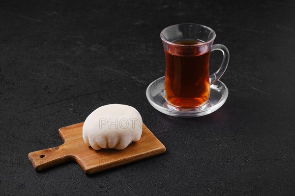 Sweet dessert mochi with coconut chips with fruit tea