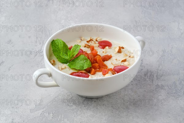 Oatmeal with almonds and dried apricots in a bowl