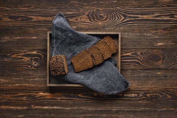 Fresh rye brown bread on wooden cutting board