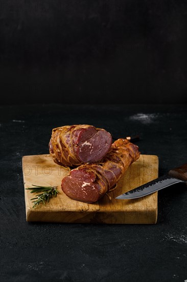 Smoked beef fillet meat on cutting board