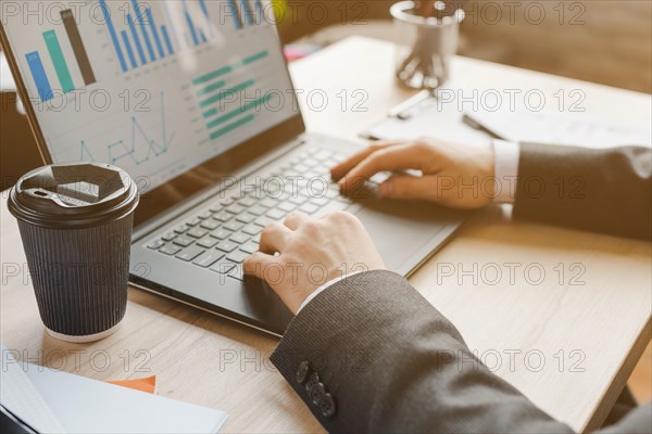 Office desktop with laptop analytics