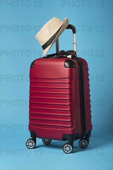 Red luggage with blue background