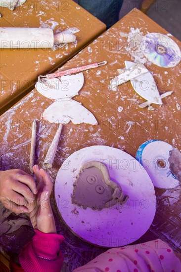 Hands holding Play Dough as Concept of sensetive education and therapy