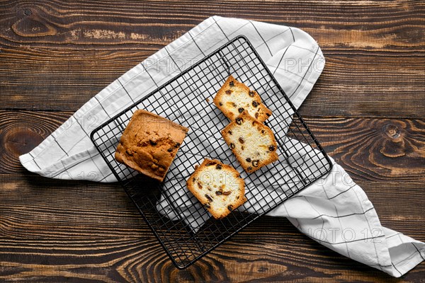 Overhead view of fresh biscuit cake with raisins on the table