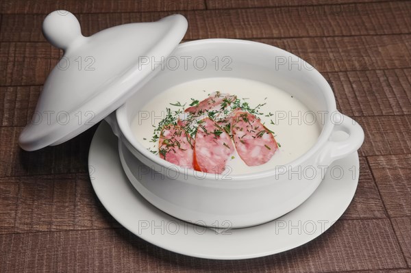 Homemade smoked sausage with cheese puree soup