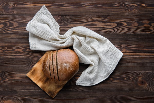 Top view of rue brown bread on cutting board