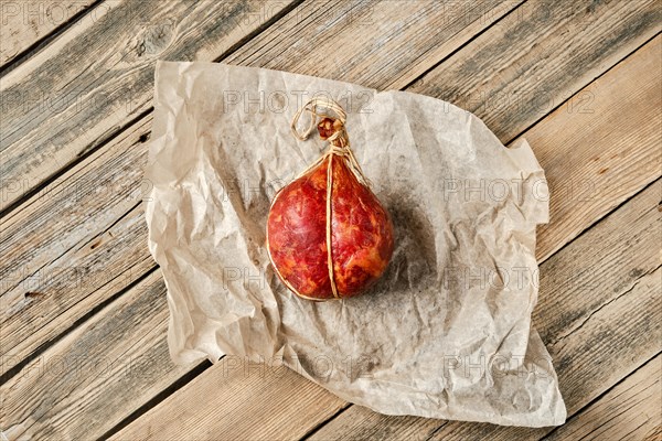 Top view of smoked dried pork and beef sausage on wrapping paper