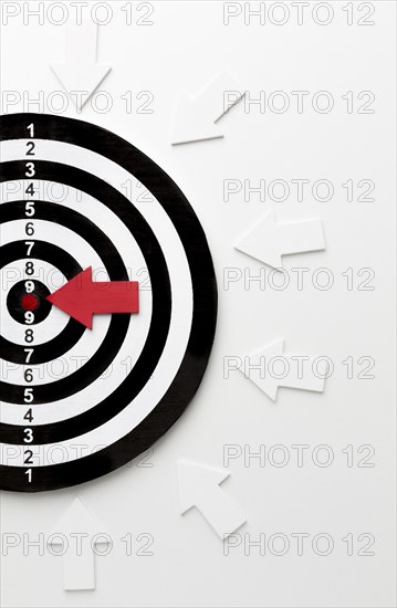 Flat lay target with arrows pointing bullseye