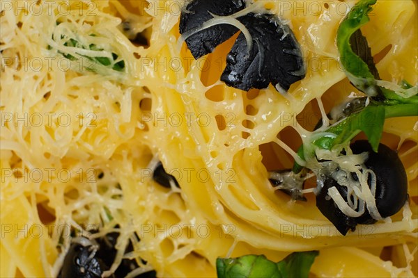 Macro photo with shallow depth of field of pasta with parmesan